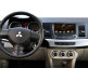 Штатная магнитола Synteco (Road Rover) i10 Mitsubishi Lancer X (с/без Rockford) - Вид штатной магнитолы на Mitsubishi Lancer X  в салоне автомобиля.